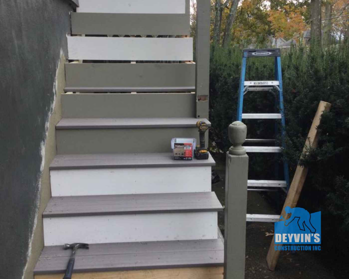 staircase railing repair and cedar painting